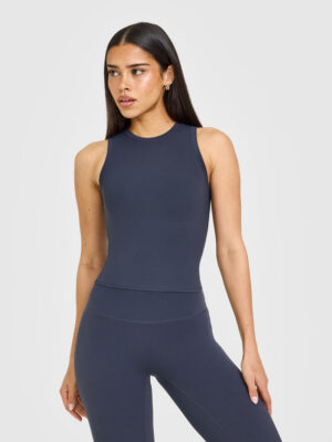 SOFTMOTION HIGH NECK MID VEST WITH WHITE LOGO