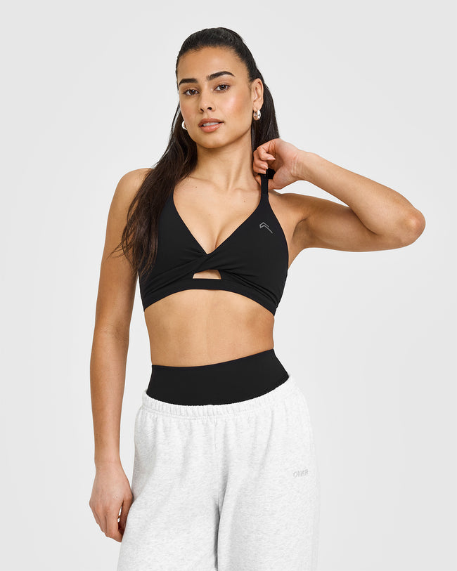 250205_RESHOOT_UNIFIED_TWIST_SPORTS_BRA_BLACK_PDP_1440x1800_01_650x.jpg