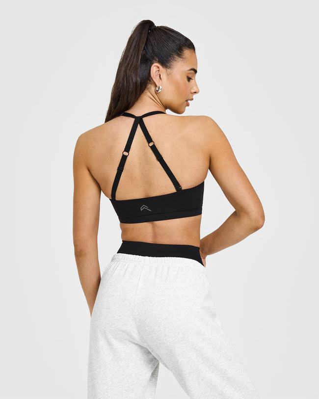 250205_RESHOOT_UNIFIED_TWIST_SPORTS_BRA_BLACK_PDP_1440x1800_02_650x.jpg