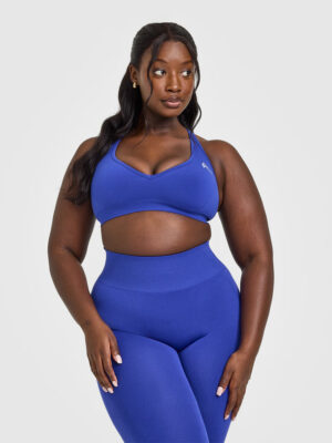 EFFORTLESS SEAMLESS RACER BACK SPORTS BRA WITH WHITE LOGO