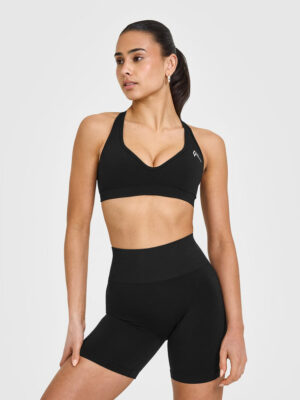 EFFORTLESS SEAMLESS RACER BACK SPORTS BRA WITH WHITE LOGO