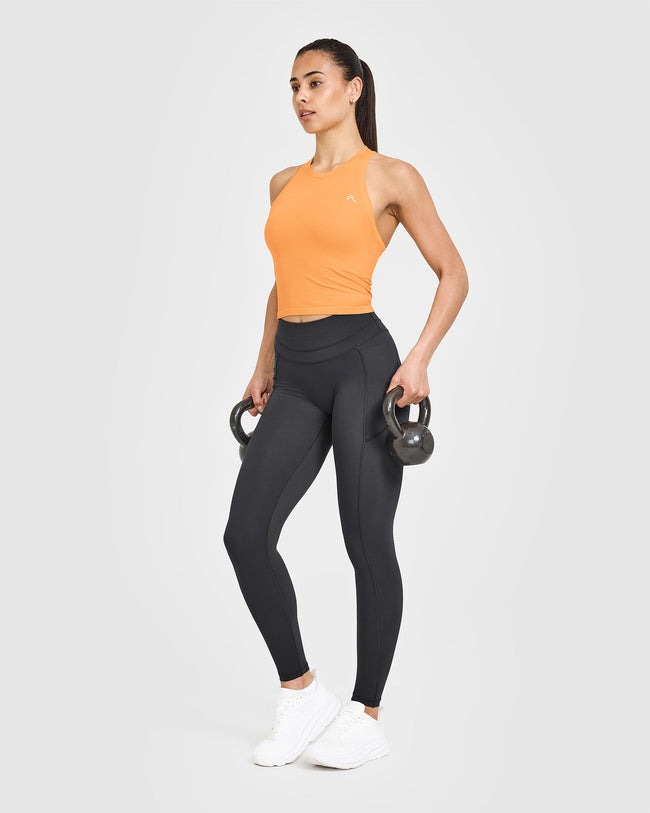 250410_HYBRID_GO_TO_SEAMLESS_FITTED_HIGH_NECK_MID_VEST_POWDEREDORANGE_PDP_1440x1800_03_650x.jpg