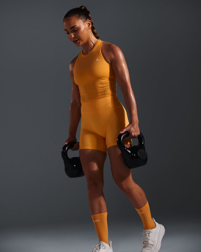 250410_HYBRID_GO_TO_SEAMLESS_FITTED_HIGH_NECK_MID_VEST_POWDEREDORANGE_PDP_1440x1800_06_650x.jpg