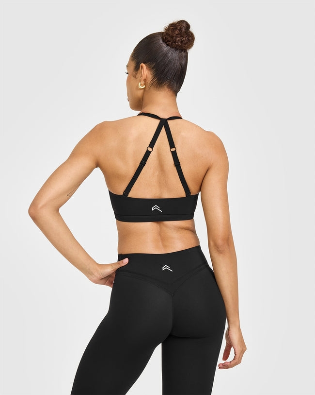 JULYBAU_UNIFIED_TWIST_SPORTS_BRA_WHITE_LOGO_BLACK_250611_PDP_1440x1800_02_650x.jpg