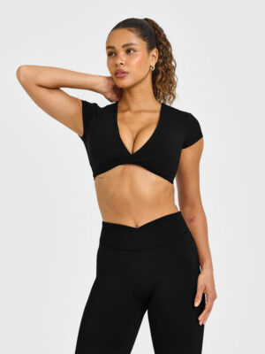 UNIFIED TWIST FRONT SHORT SLEEVE CROP TOP WHITE LOGO