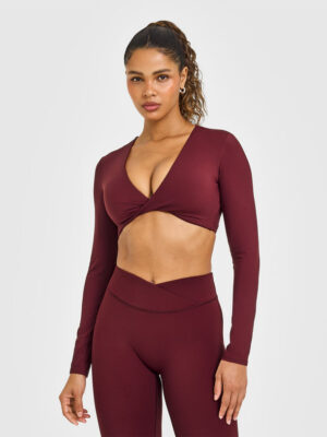 UNIFIED TWIST FRONT LONG SLEEVE CROP TOP WHITE LOGO