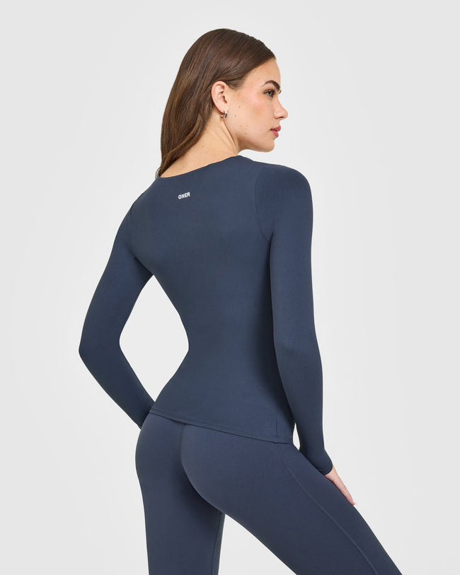 OAXMIA_SOFTMOTION_SCOOP_NECK_LONG_SLEEVE_TOP_BUILT_IN_BRA_SHELF_TRUEBLUE_251001_PDP_1440x1800_02_650x.jpg